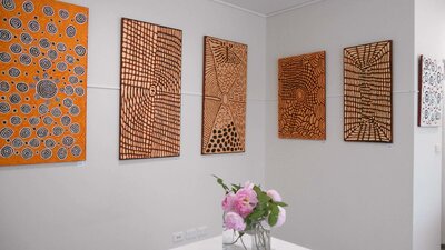 Aboriginal art paintings by Papunya Tula Artists on exhibition at Artworld ADG